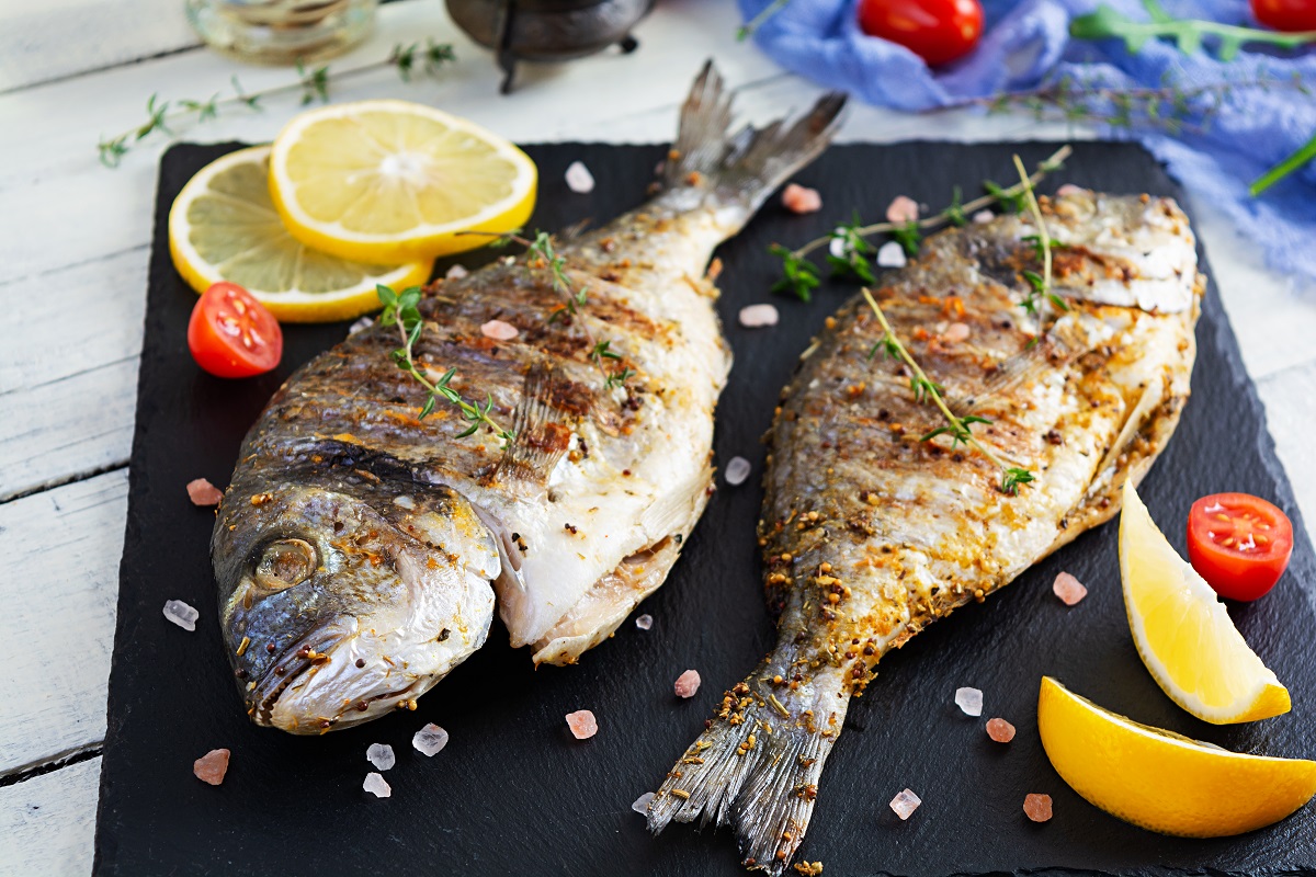 Grilled,Dorado,Fish,On,Wooden,Background.,Roasted,Seafish,With,Spice