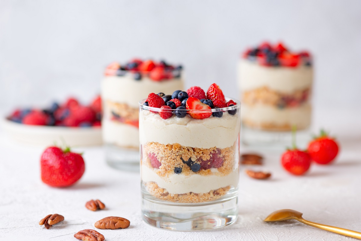Dessert,In,A,Glasses,With,Berries,,Whipped,Cream,And,Biscuit.