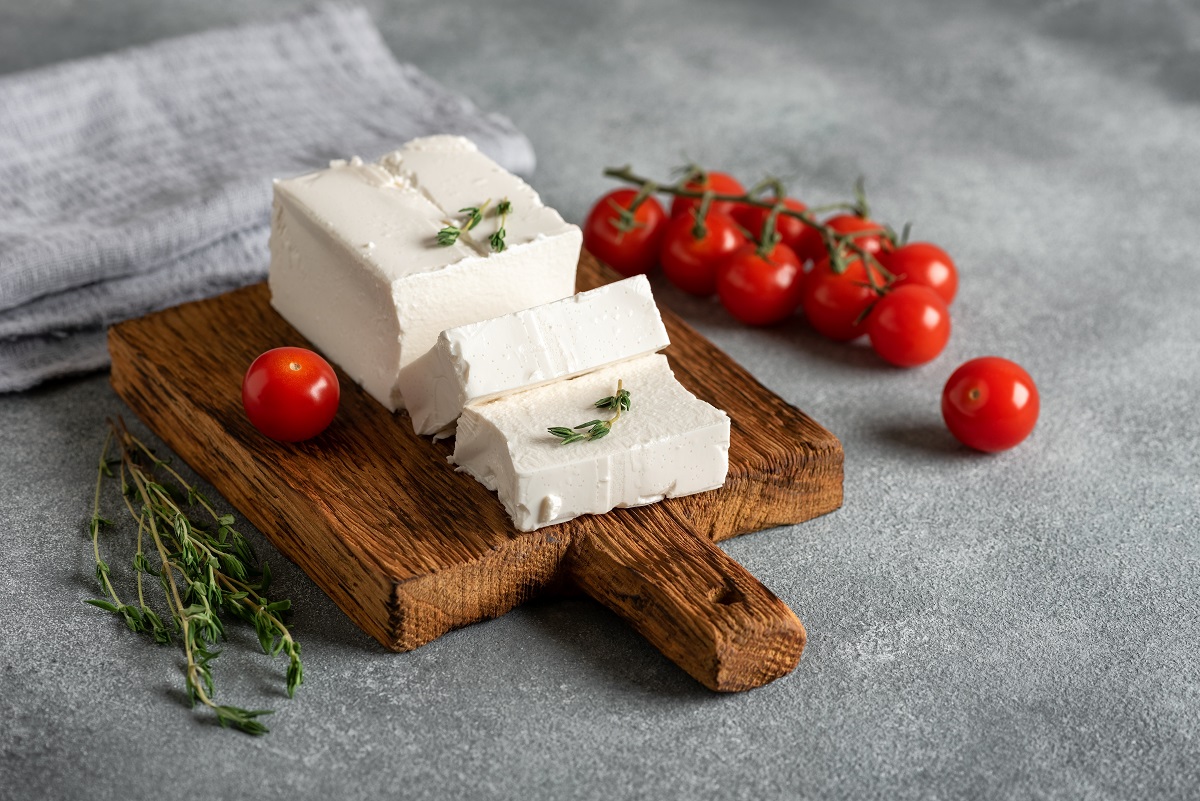 Fresh,Feta,Cheese,On,A,Wooden,Board,With,Thyme,And