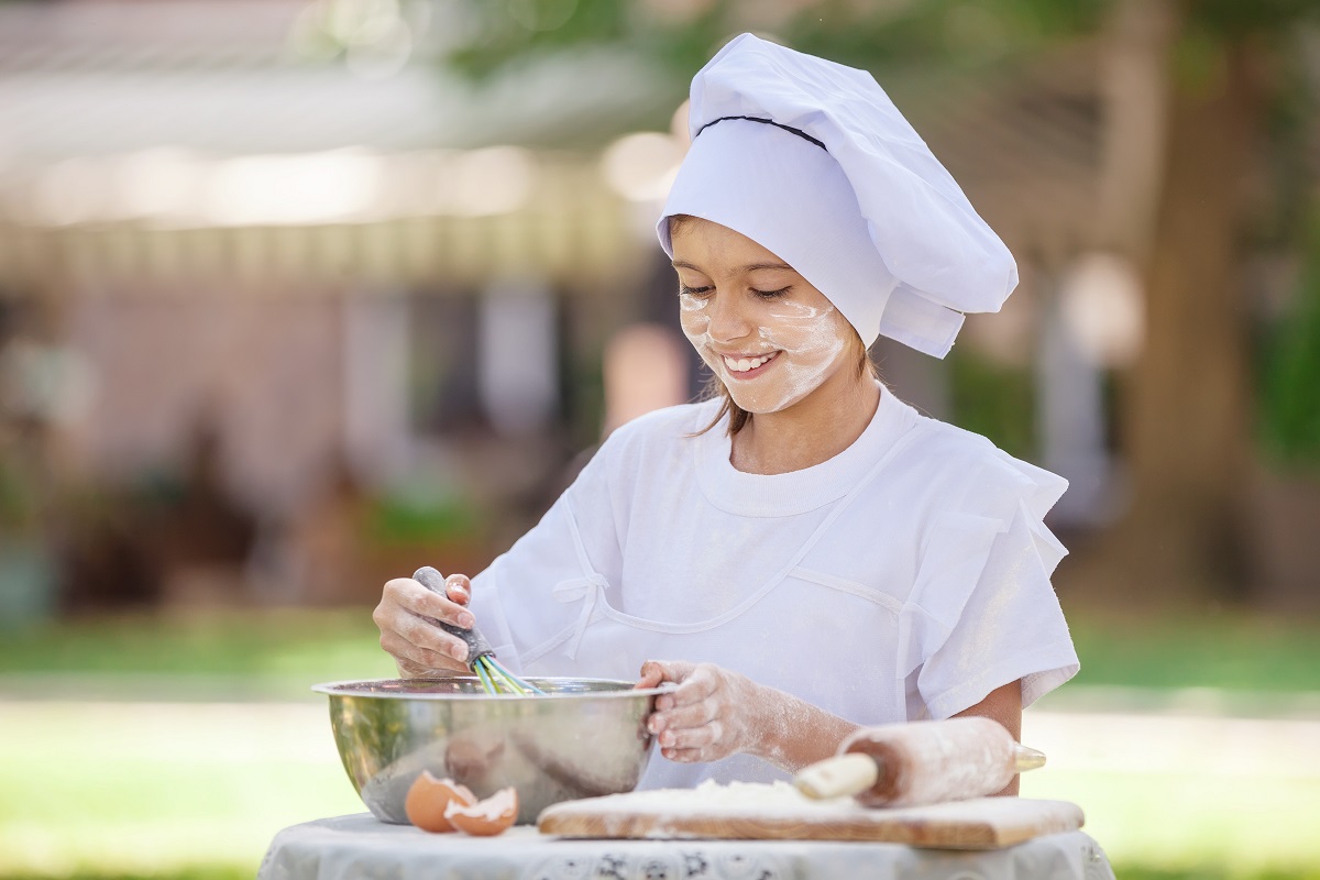 Happy,Little,Chef,Whipping,Eggs,In,A,Bowl,Outdoors