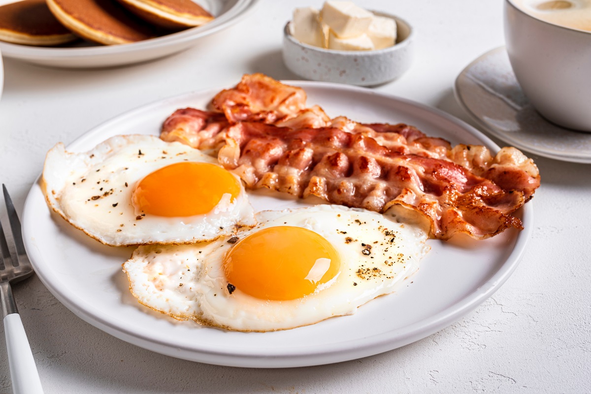 Breakfast,With,Fried,Eggs,And,Bacon,Close,Up.,Fried,Sunny