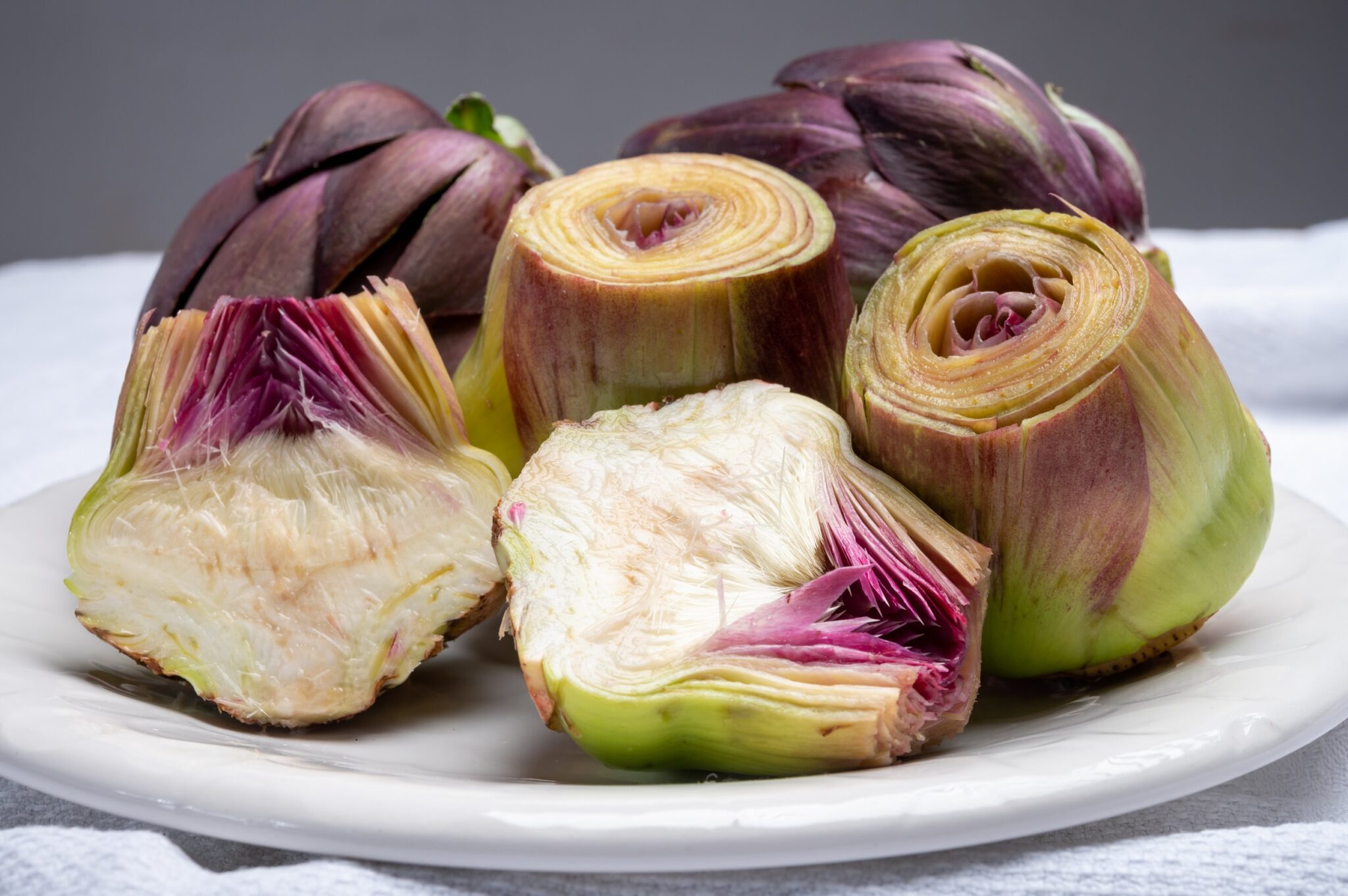 Heads,Of,Raw,Fresh,Purple,Romanesco,Artichoke,Vegetable,Heads,And