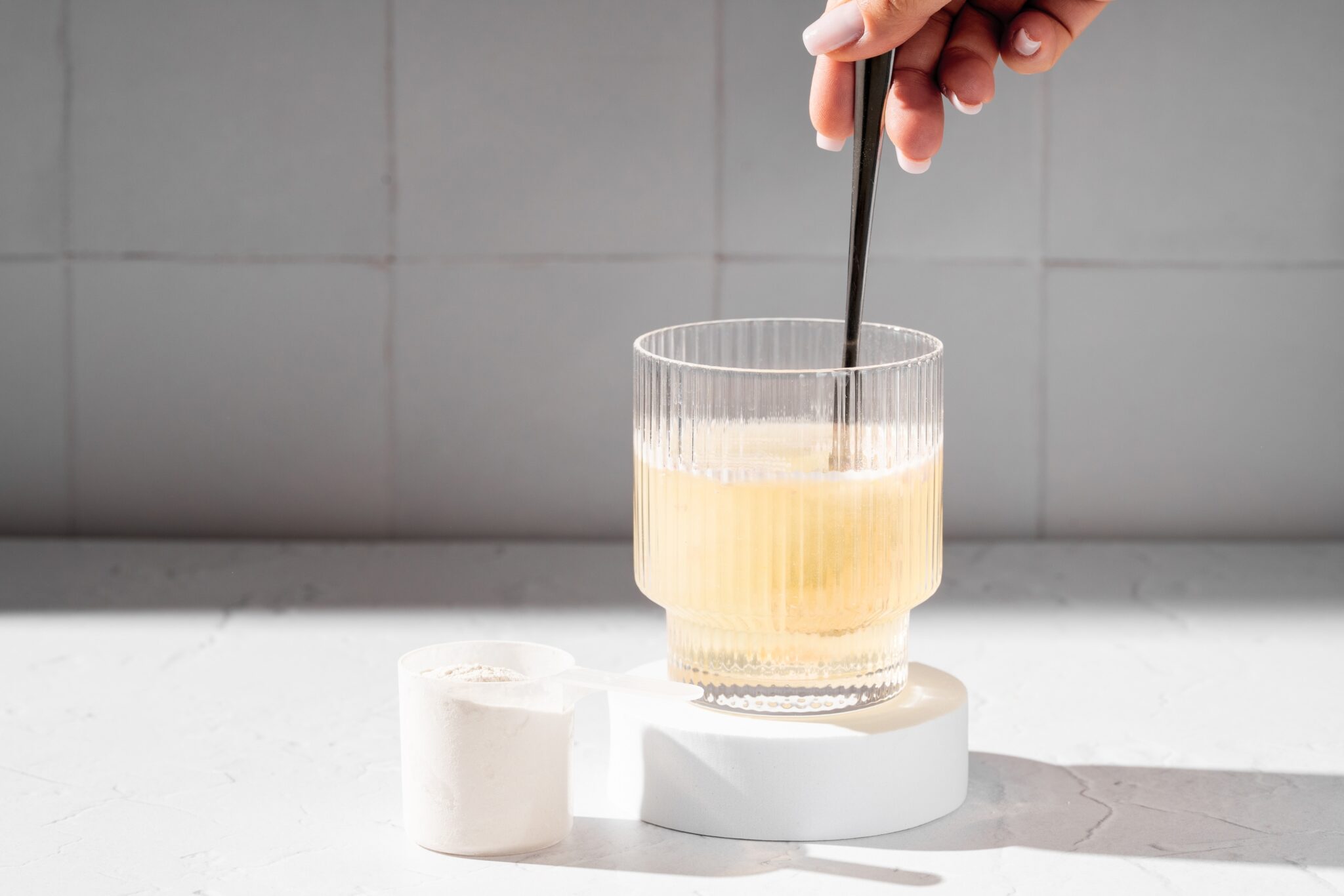 Collagen,Protein,Powder,In,A,Scoop.,Glass,Of,Collagen,Beauty