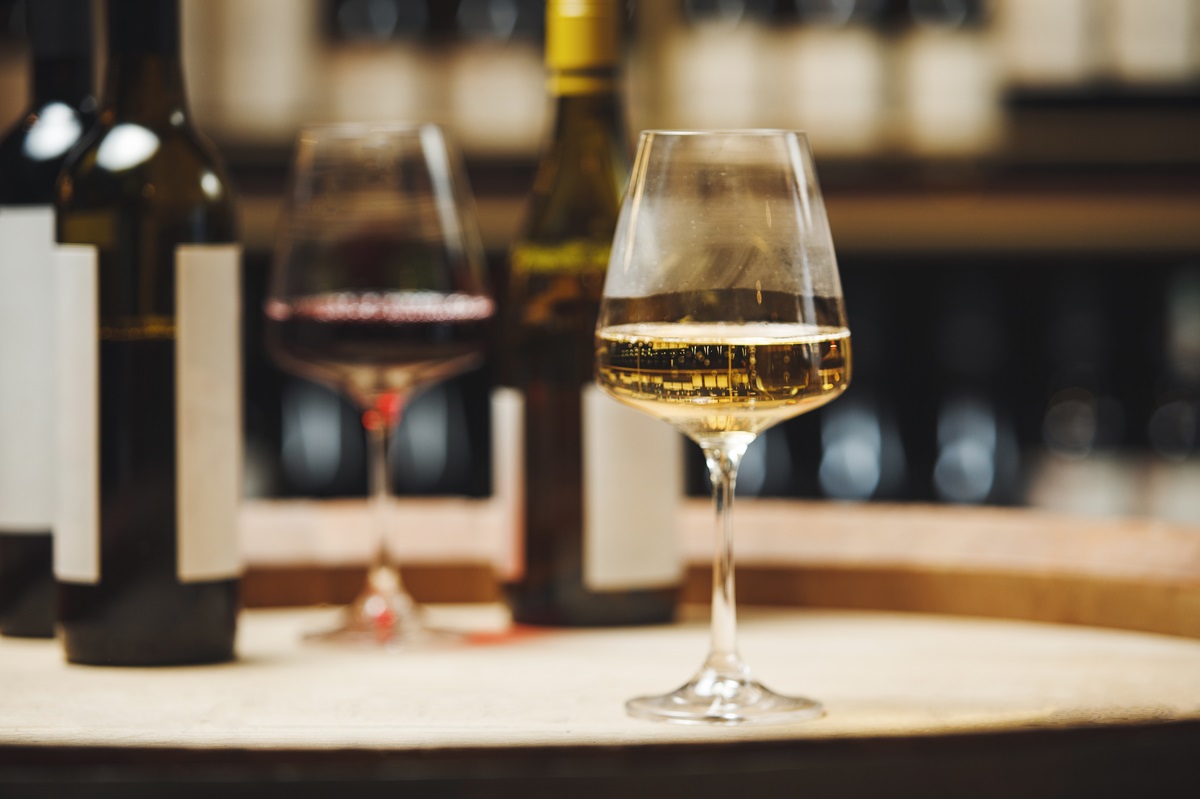 Close-up,Of,Wine,Glasses,On,Wooden,Barrel,In,Cellar