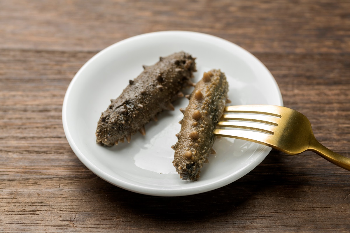 A,Close,Up,Of,Sea,Cucumber,On,A,Wooden,Desktop