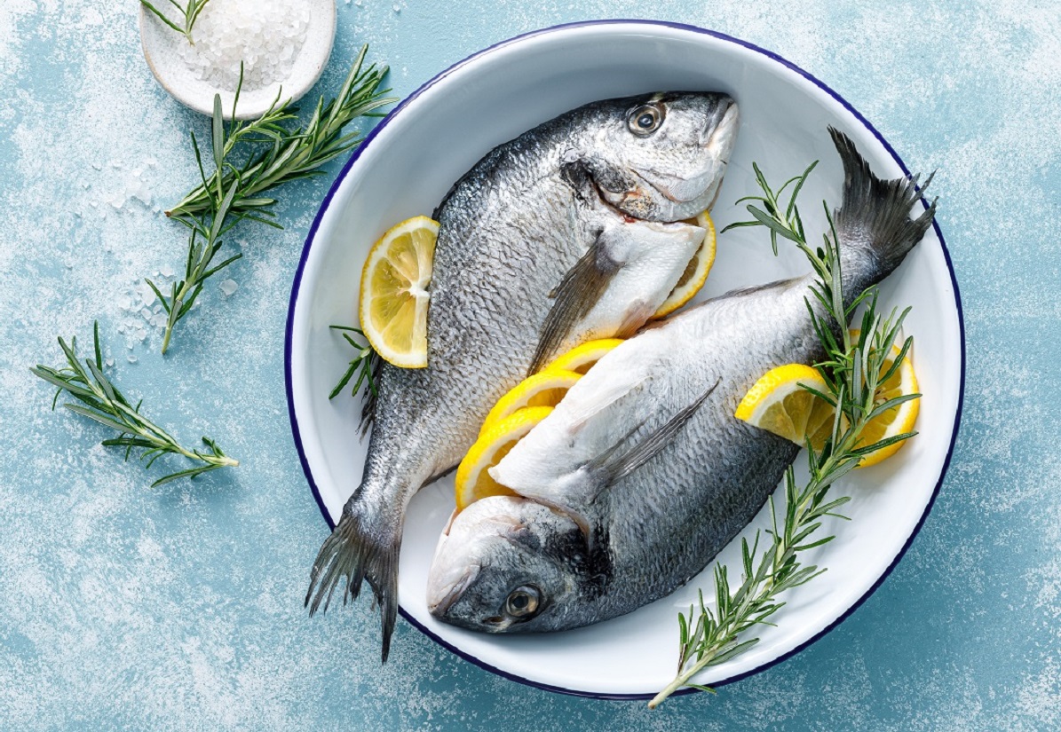 Fresh,Raw,Dorado,Fish,Cooking,With,Lemon,And,Rosemary.,Sea