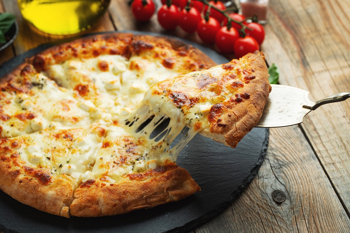 A,Slice,Of,Hot,Italian,Pizza,With,Stretching,Cheese.,Pizza