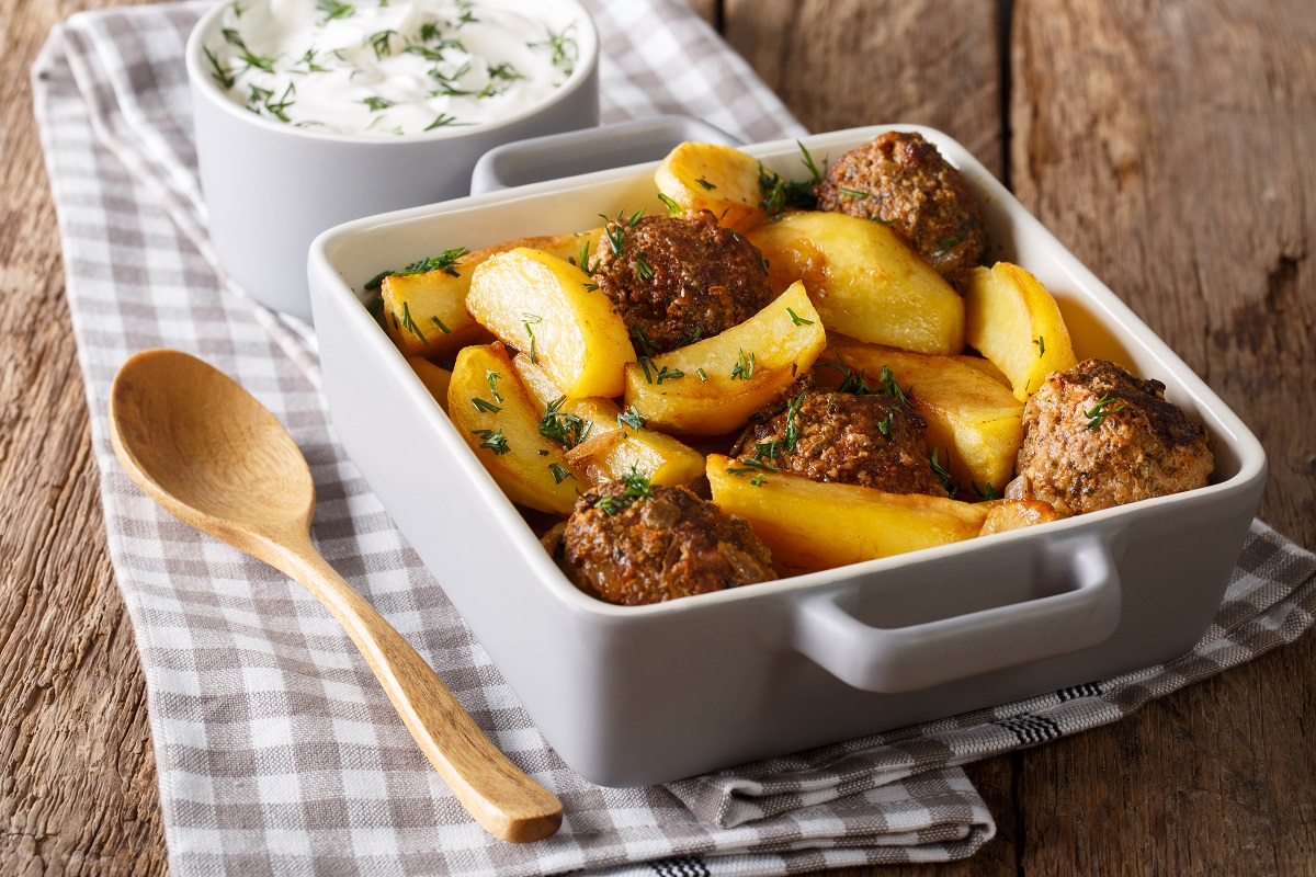 Potato,Wedges,And,Meatballs,,Herbs,In,A,Dish,Close-up,On