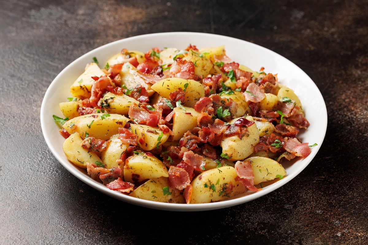 German,Potato,Salad,With,Bacon,And,Herbs,In,A,White