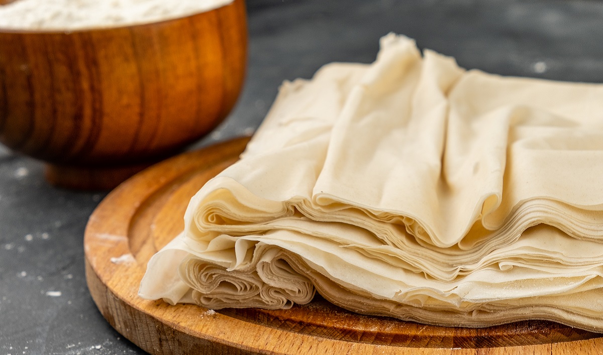 Homemade,Filo,Dough,On,A,Dark,Table,Lies,On,A