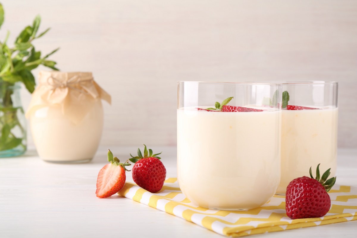 Tasty,Yogurt,And,Strawberries,In,Glasses,On,White,Wooden,Table,