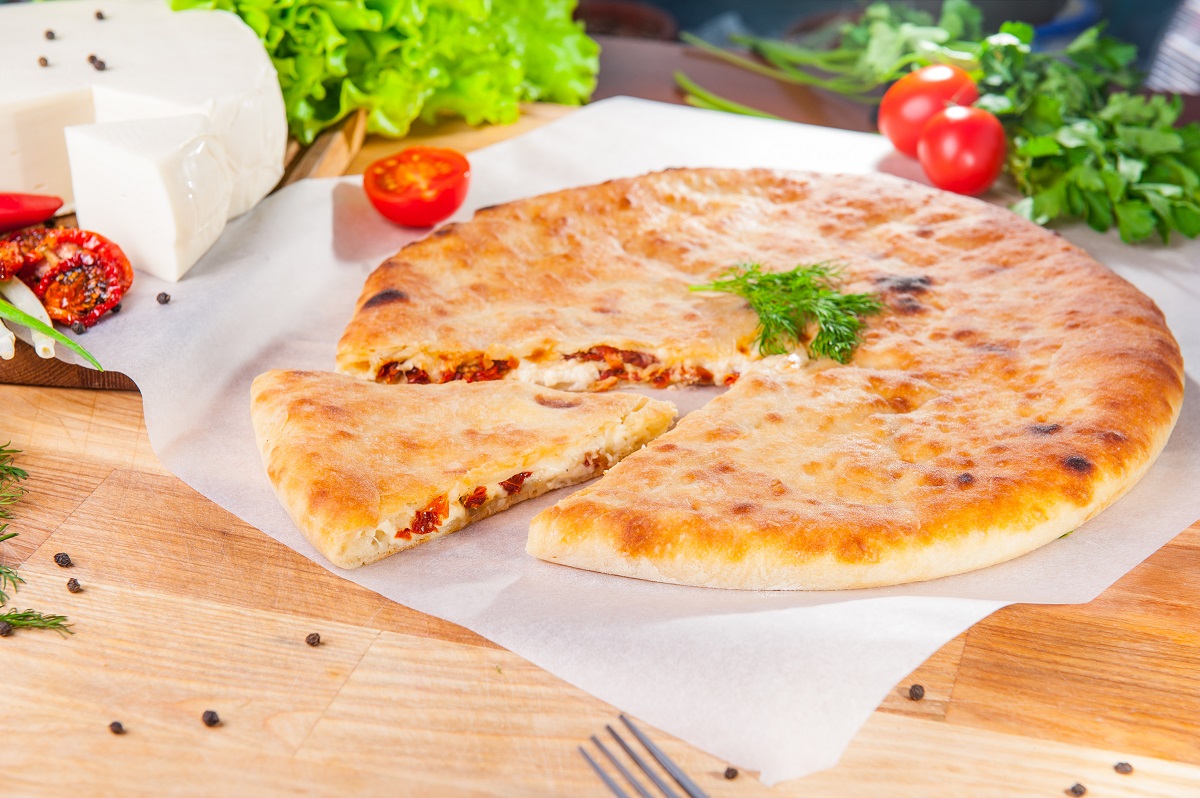 Selective,Focus,Vegetable,Closed,Pies,With,Cheese,And,Sun-dried,Tomatoes